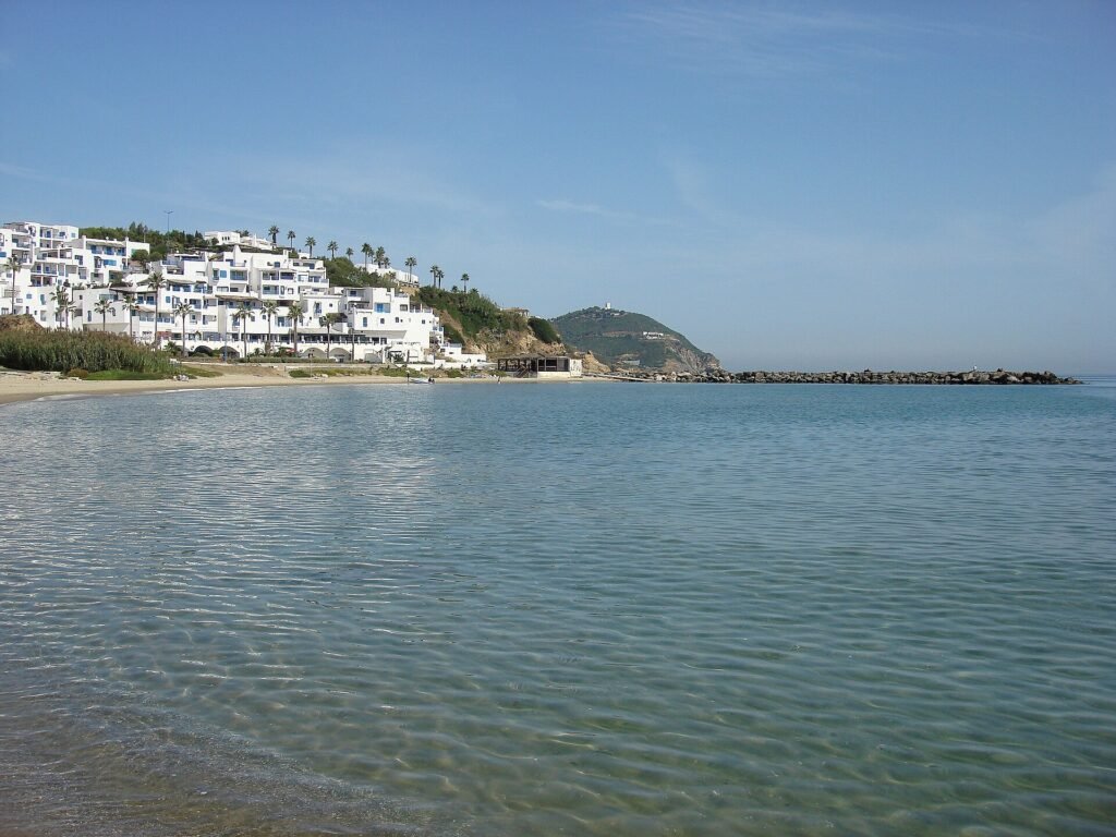 Cabo Negro beach and the white resort on the hillside above it