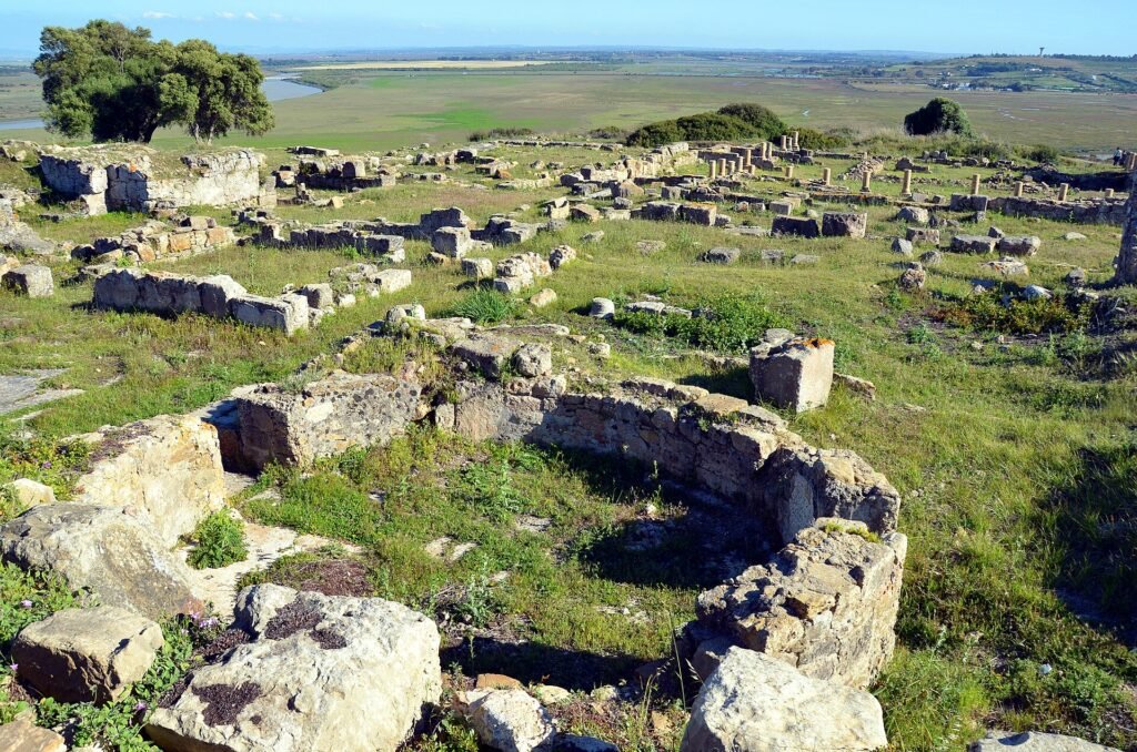 Excavated walls on a Lixus day trip from Tangier, above the Loukkos estuary