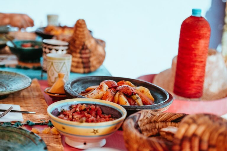 Moroccan dishes and tagines served at a family table on a Tangier food tour