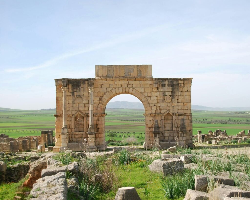 Roman arch at Volubilis on a private Chefchaouen to Fes transfer