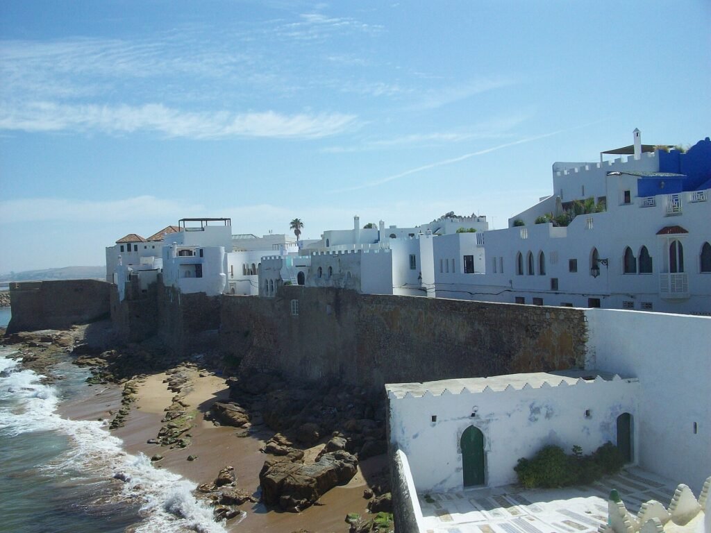 The white walls of Asilah above the Atlantic waves, on a northern Morocco itinerary