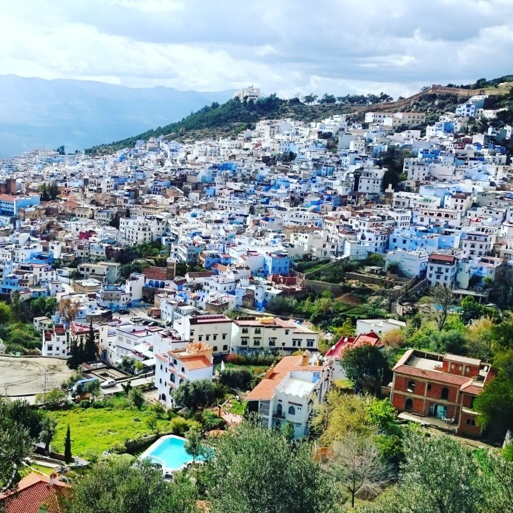 The blue town of Chefchaouen on the hillside below the mountains of the Rif