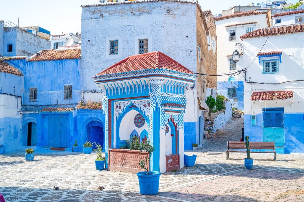 A blue tiled fountain on a small square in the blue medina of Chefchaouen