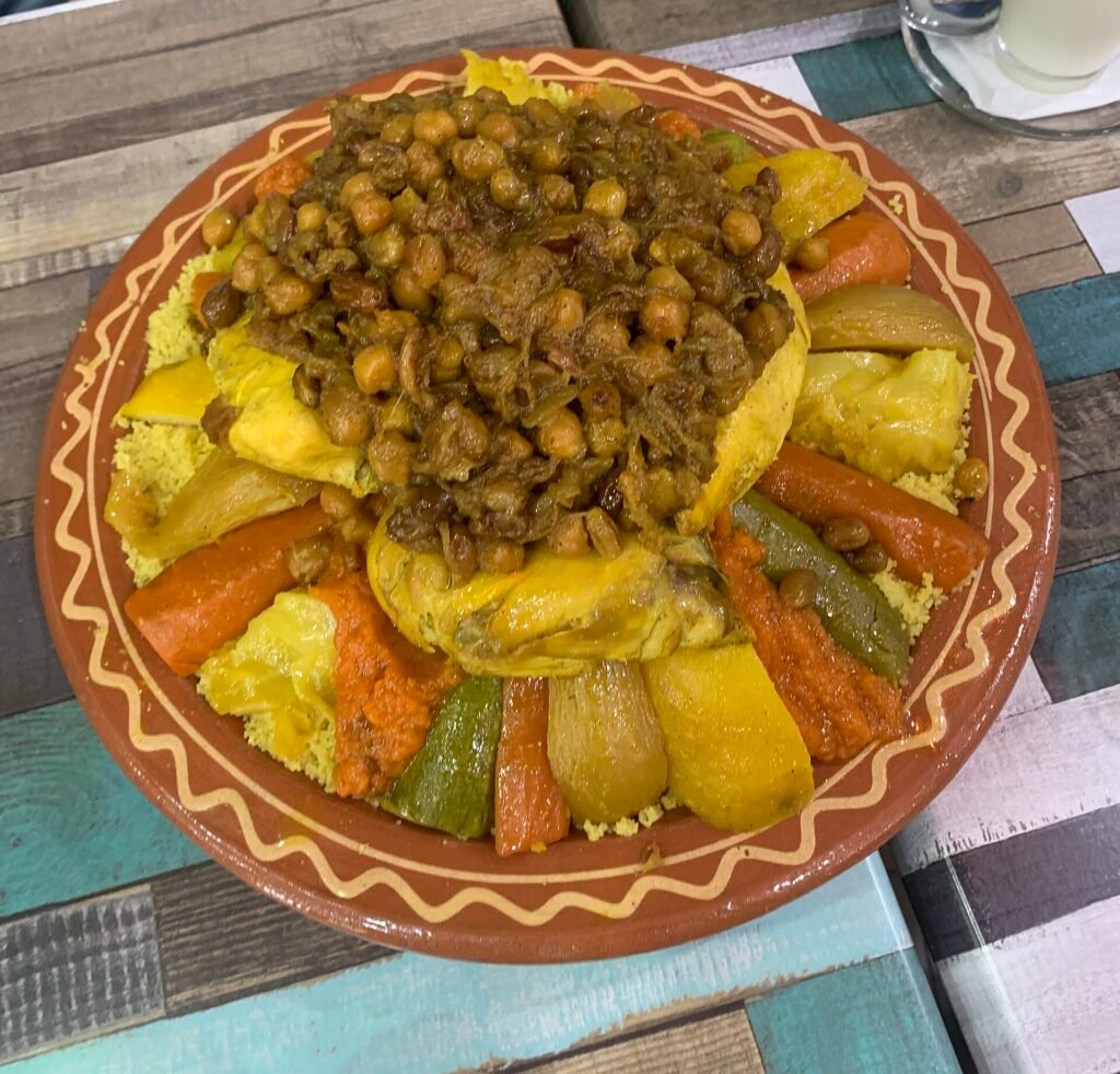 A plate of Moroccan couscous with vegetables and chickpeas