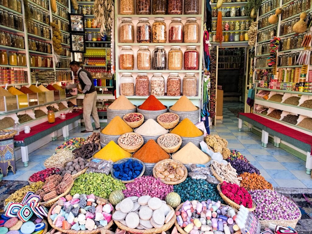 A spice shop in a Moroccan souk with pyramids of colourful spices