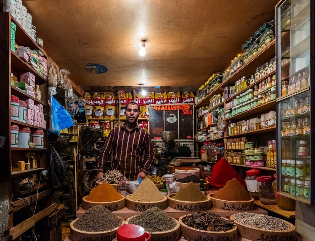 A spice shop on the Grand Socco of Tangier with bowls of colourful spices