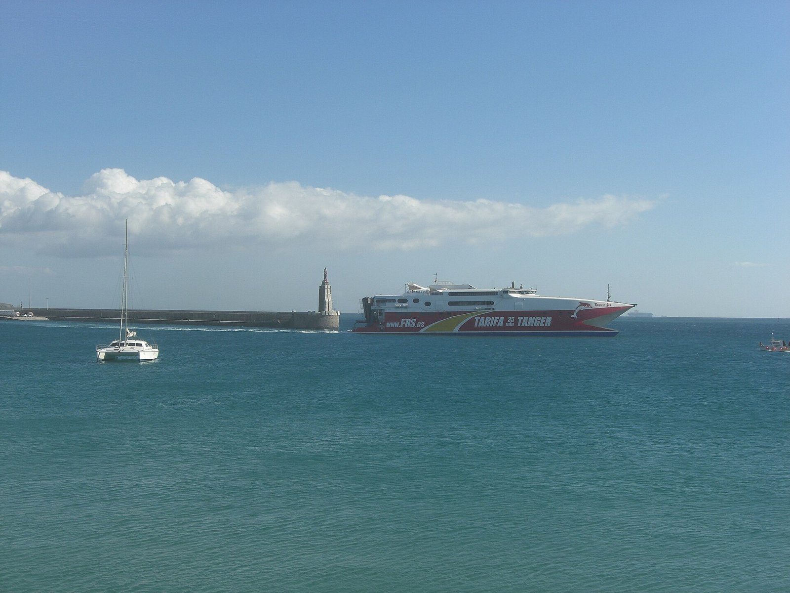 A fast catamaran ferry leaving the port of Tarifa for Tangier