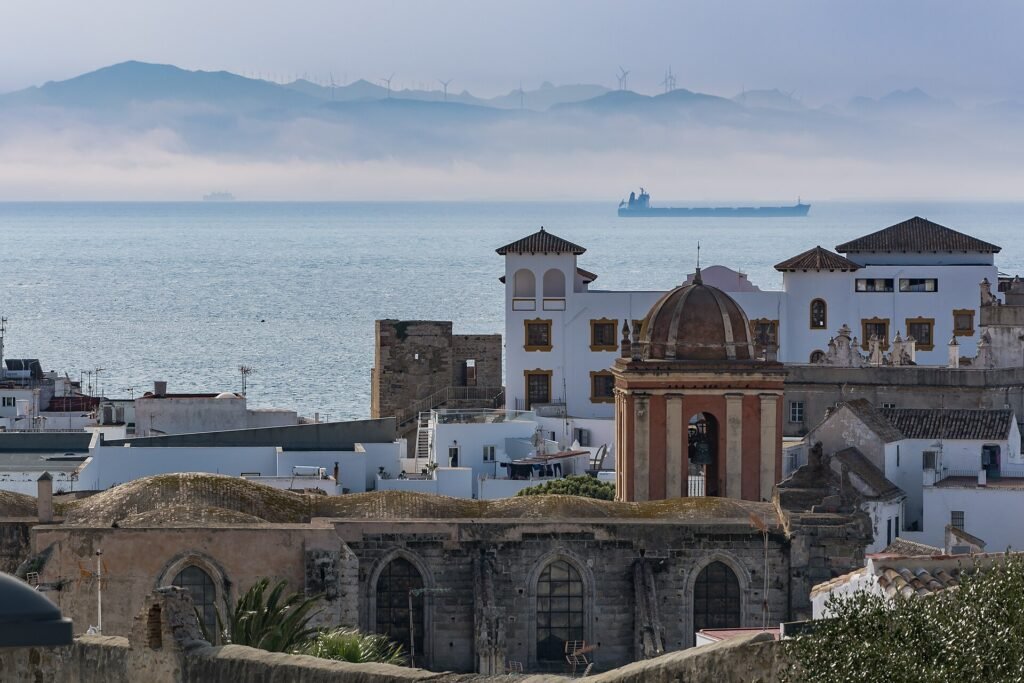 Tarifa old town with the mountains of Morocco across the Strait, the start of a Tangier day trip from Spain